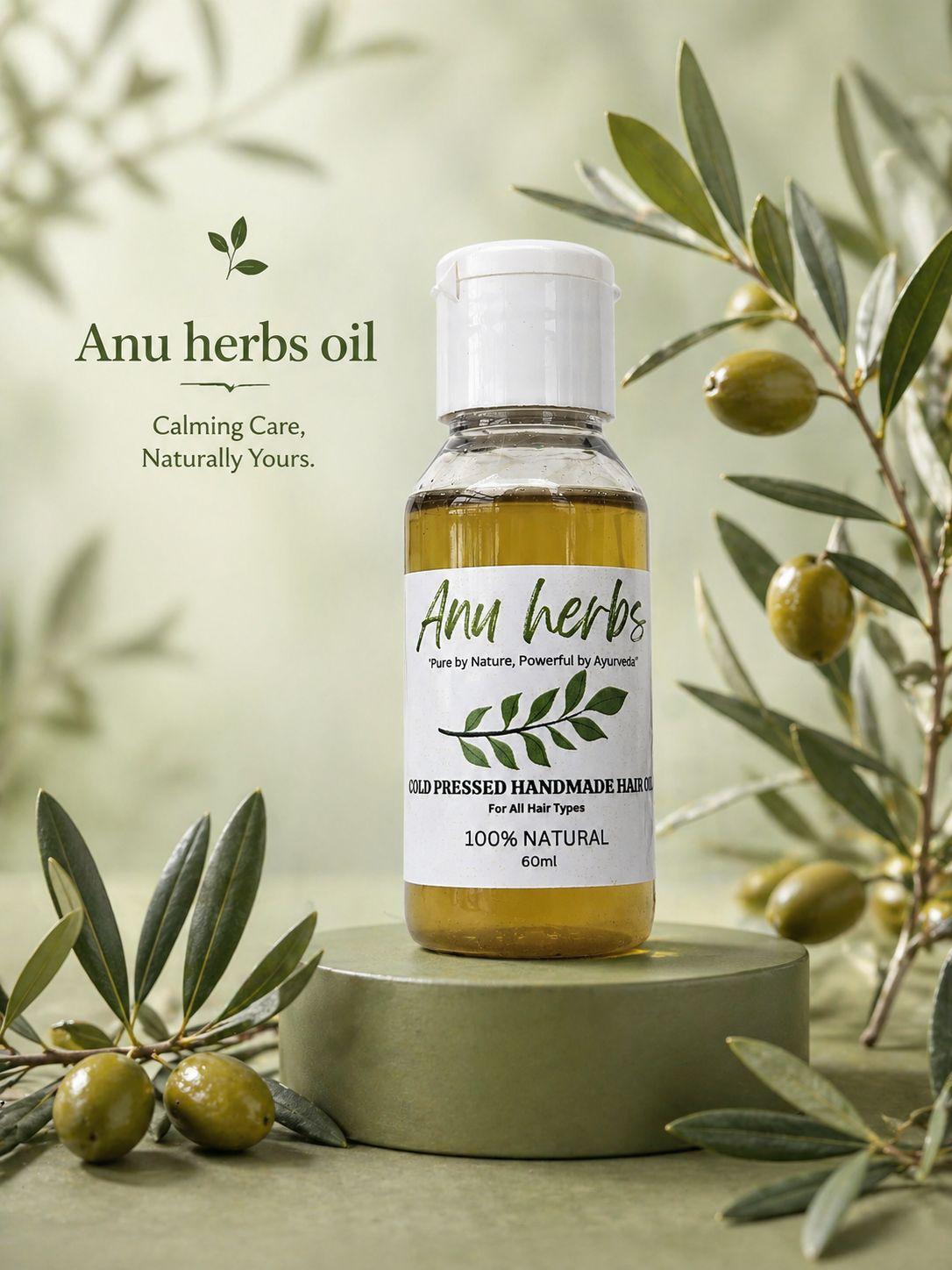 Anu Herbs Handmade Hair Oil Bottle surrounded by Olives